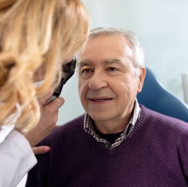 Older Man Having an Eye Exam by Doctor